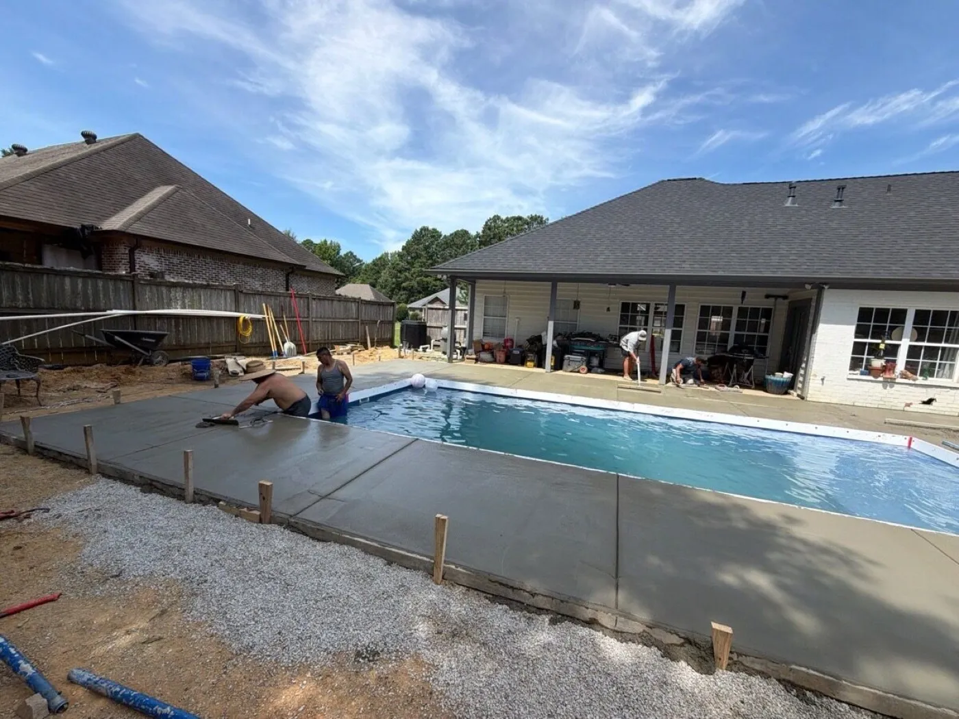 Concrete deck pour around a new fiberglass pool